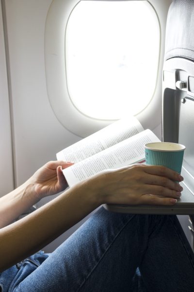 reading-book-holding-cup